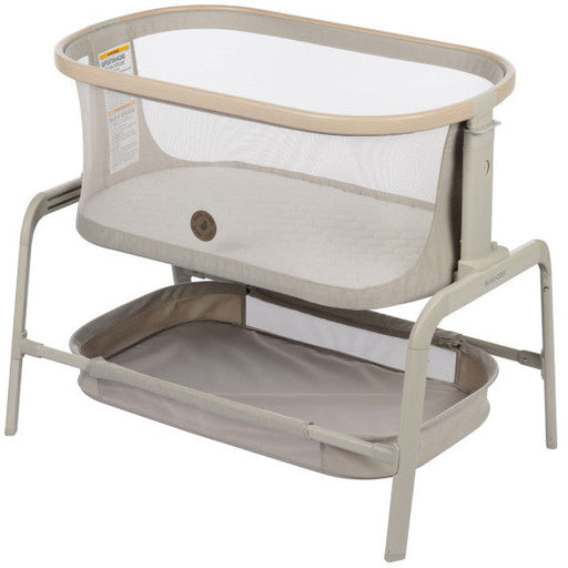 Portable crib with a mesh cover, featuring the Maxi-Cosi Iora 2-in-1 Co-Sleeper design for safe co-sleeping.
