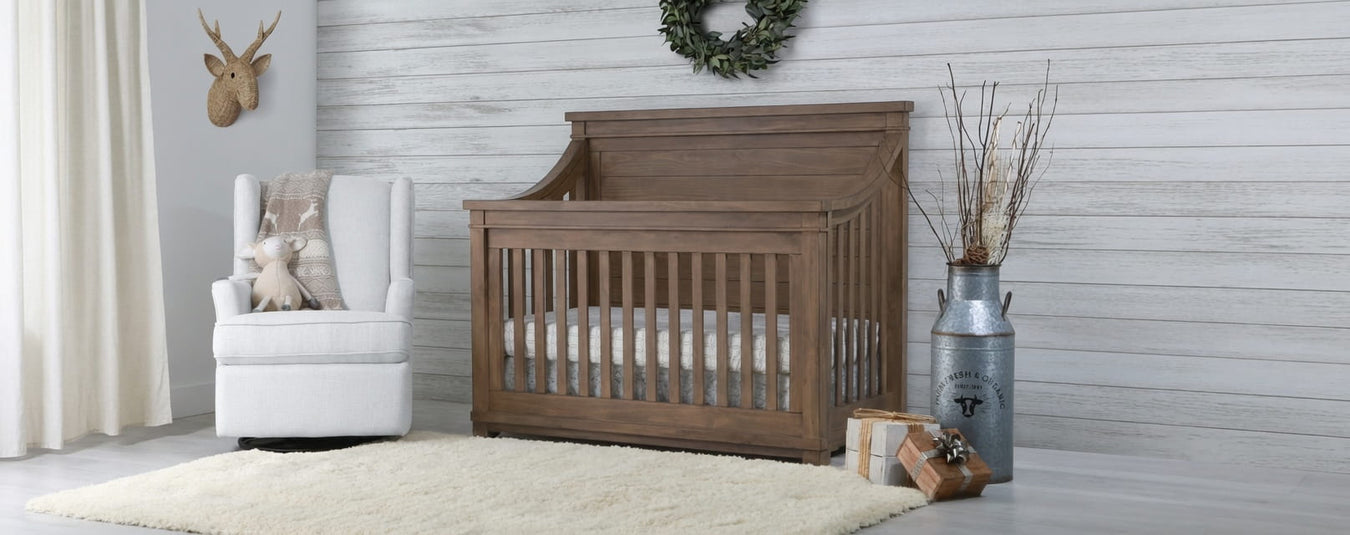 Appleseed Rowan Flat Convertible Crib in Sandwash, shown in a beautiful nursery setting at Kids N Cribs Bay Area