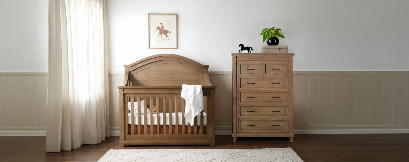 Appleseed Rowan Arch Crib and Chest in Sandwash finish, displayed in a beautiful nursery setting at Kids N Cribs Bay Area