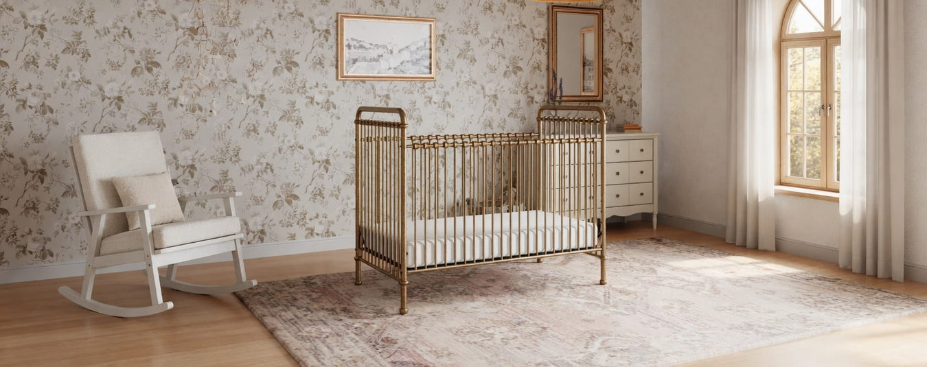 Namesake Abigail Metal Convertible Crib in Vintage Gold, shown in a beautiful nursery setting at Kids N Cribs Bay Area