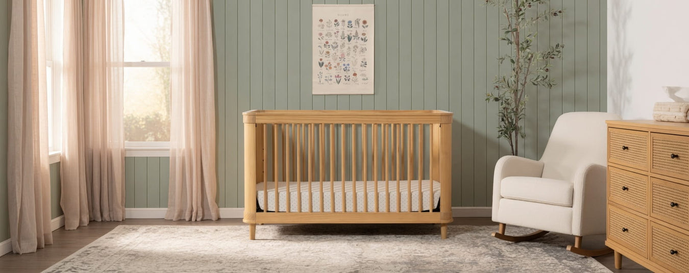 Namesake Marin Convertible Crib in Honey with Honey Cane, shown in a beautiful nursery setting at Kids N Cribs Bay Area