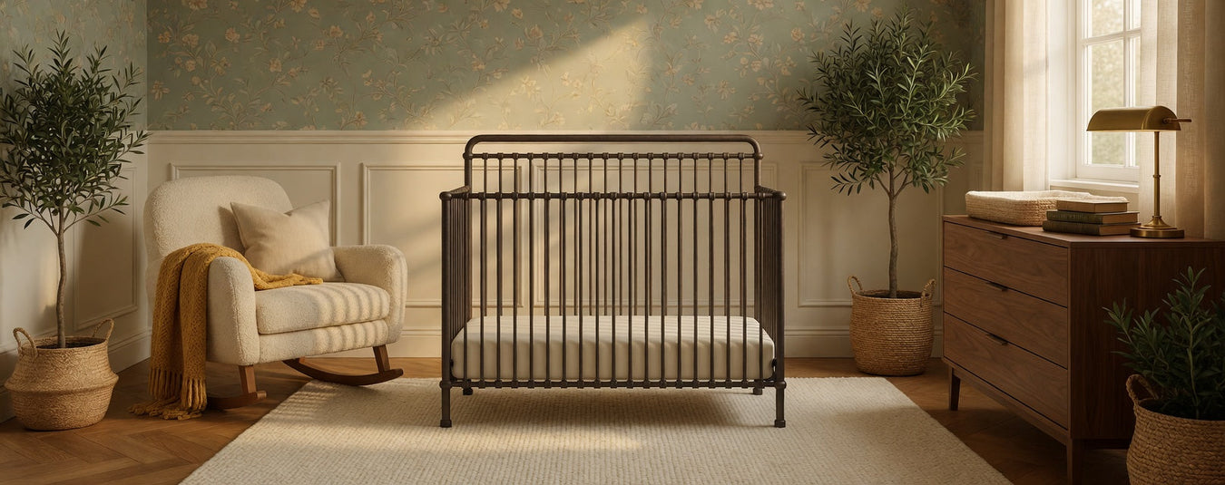 Namesake Winston Metal Convertible Crib in Vintage Iron, shown in a beautiful nursery setting at Kids N Cribs Bay Area