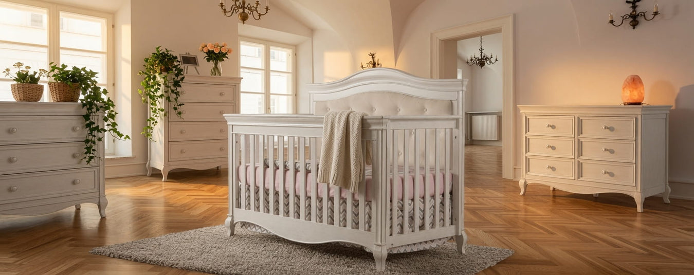 Pali Diamante Convertible Crib in Vintage White with Beige Upholstered Headboard, shown in a beautiful nursery setting at Kids N Cribs Bay Area