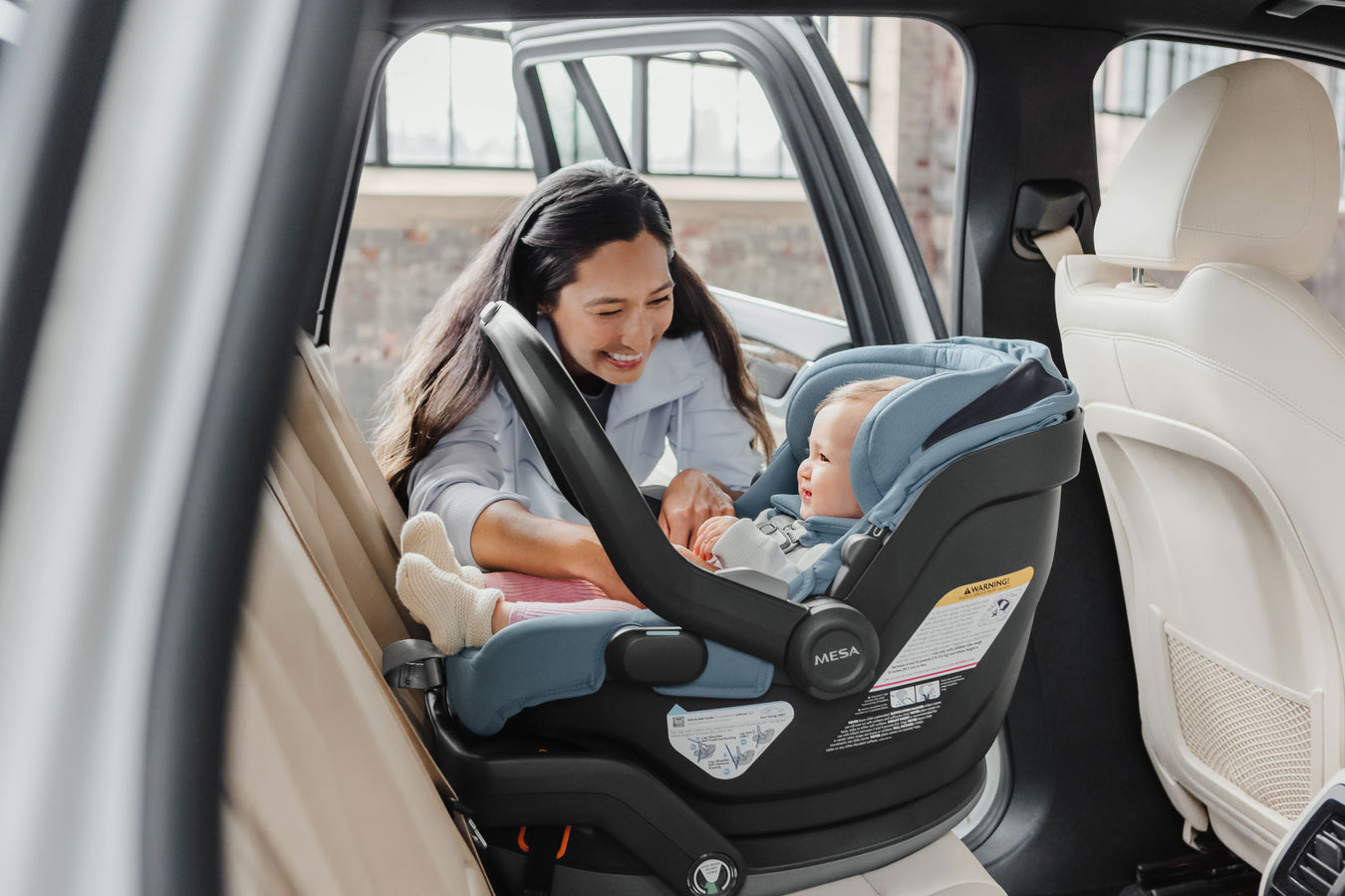 Certified technician installing UPPAbaby Mesa car seat in Brentwood CA