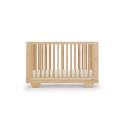 Dadada Spirit crib in modern nursery setting – premium hardwood finish
