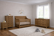 Appleseed Rowan 4-piece nursery set in Sandwash with flat-top crib, double dresser, tall chest, and nightstand