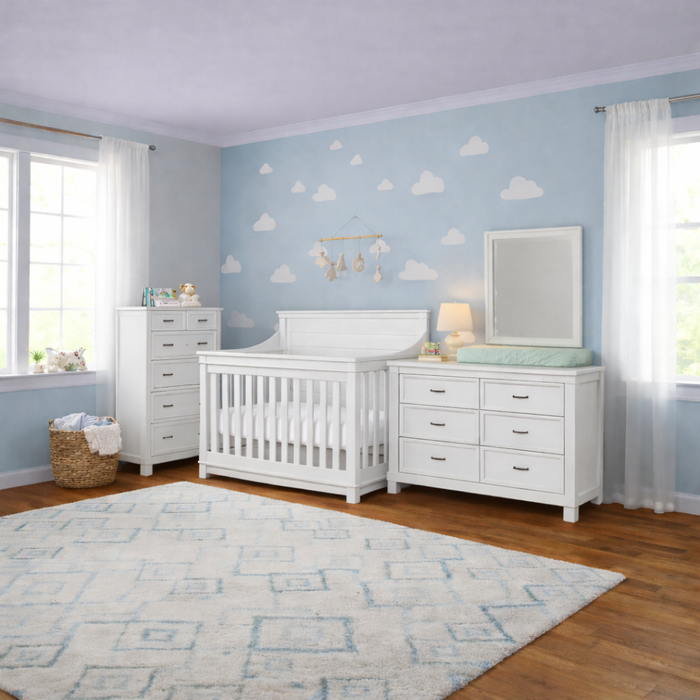 Appleseed Rowan 3-piece nursery set in white featuring flat-top crib, double dresser, and tall chest in a bright nursery
