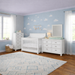Appleseed Rowan 3-piece nursery set in white featuring flat-top crib, double dresser, and tall chest in a bright nursery