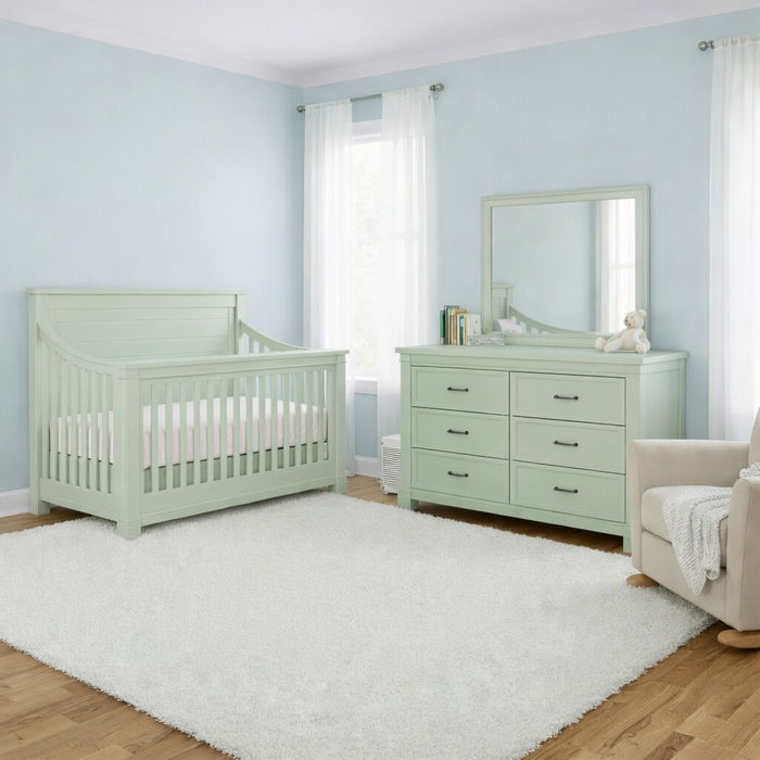 Appleseed Rowan 2-piece nursery set in Sage with flat convertible crib and coordinating double dresser in a lifestyle room