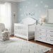 Appleseed Rowan Arch crib and dresser nursery set in pure white finish, styled in a bright nursery room