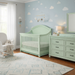 Appleseed Rowan Arch crib and dresser nursery set in sage green finish, styled in a soft modern nursery