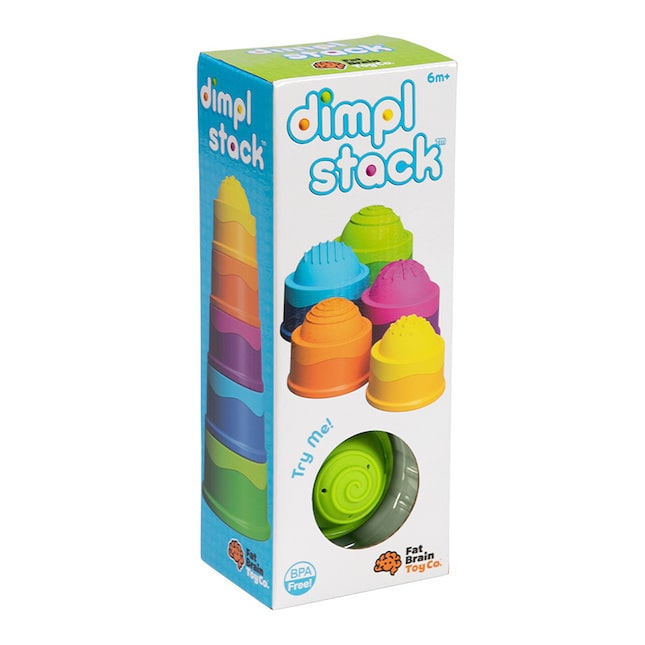 A box of colorful plastic stacking toys from Fat Brain Toys Dimpl Stack, featuring various shapes and sizes for play.